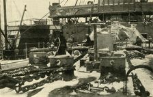 Ship supplying coal in freezing conditions, First World War, 1914, (c1920). Creator: Unknown