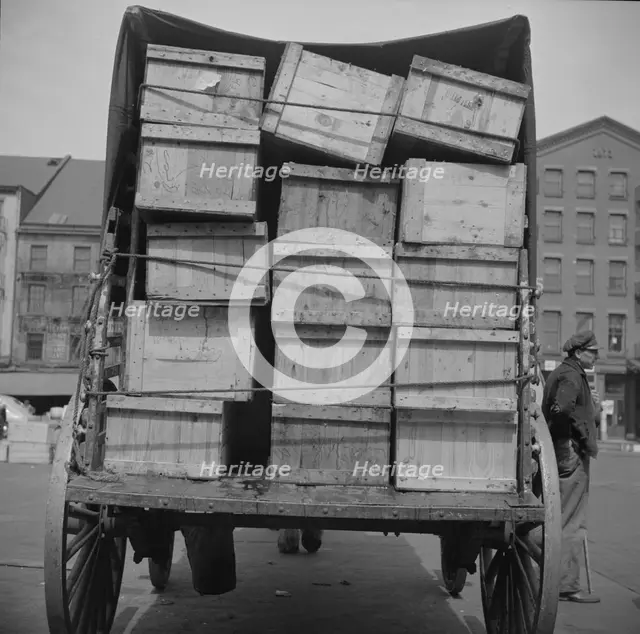 Shipping fish by horse-drawn vehicle from Fulton fish market, New York, 1943. Creator: Gordon Parks.