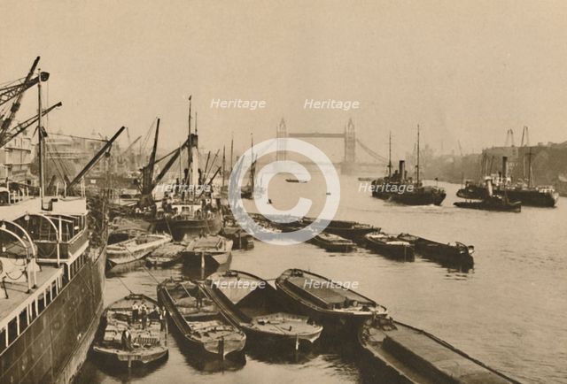'Shipping in the Pool of London: A Vista from London Bridge to Tower Bridge', c1935. Creator: Donald McLeish.