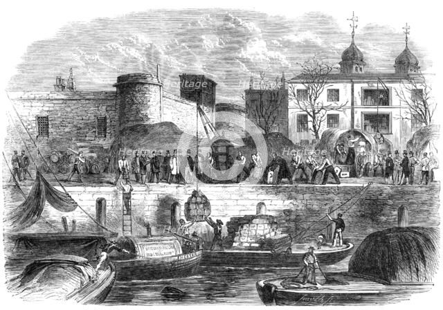 Shipping munitions of war at the Tower for Canada, 1861. Creator: Smyth.