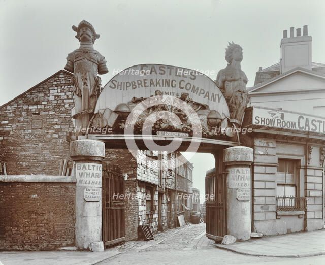 Ships' figureheads over the gate at Castle's Shipbreaking Yard, Westminster, London, 1909. Artist: Unknown.