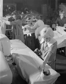 Shirt pressing at a commercial laundry in Scunthorpe, Lincolnshire, 1965. Creator: Michael Walters