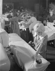Shirt pressing at a commercial laundry in Scunthorpe, Lincolnshire, 1965. Artist: Michael Walters