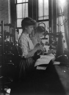 Shoe factories, Lynn, Mass.: 2 women working in shoe factory, (1895?). Creator: Frances Benjamin Johnston