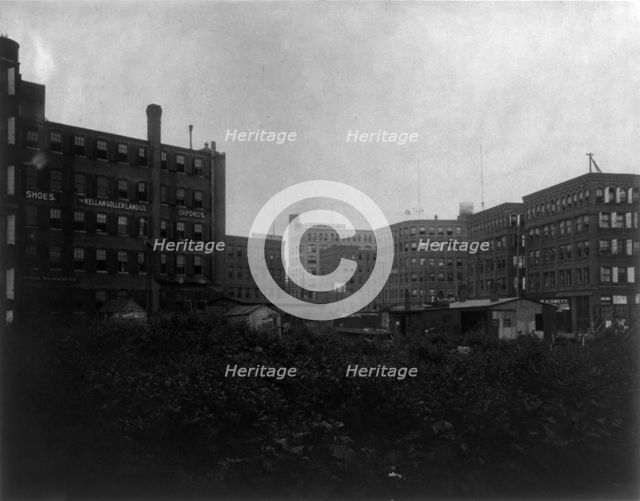 Shoe factories, Lynn, Mass.: exterior view of shoe factories and other buildings, (1895?). Creator: Frances Benjamin Johnston.