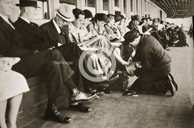 Shoe shiners working on board the Staten Island Ferry, New York, USA, c1920s-c1930s. Artist: Unknown