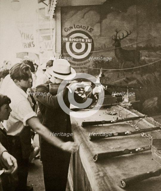 Shooting gallery at the amusement park, Coney Island, New York, USA, early 1930s. Artist: Unknown