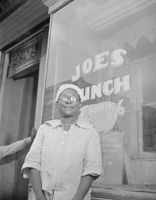 Shopper on Saturday afternoon, Washington, D.C., 1942. Creator: Gordon Parks