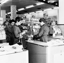 Shoppers at a checkout in a London supermarket, c1950s. Creator: Henry Grant
