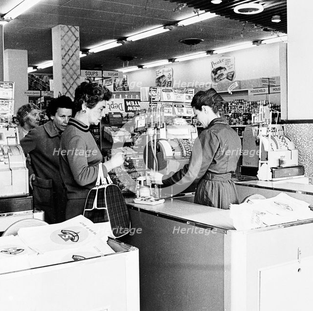 Shoppers at a checkout in a London supermarket, c1950s. Creator: Henry Grant.