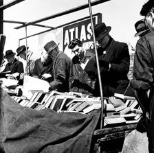 Shoppers at a London bookstall, c1950s. Creator: Henry Grant
