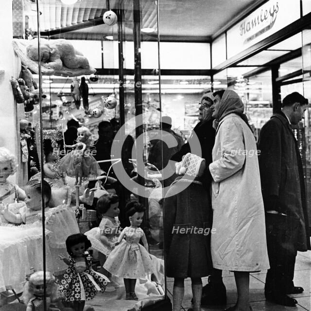 Shoppers window shopping in London, c1960. Artist: Unknown