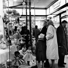 Shoppers window shopping in London, c1960. Creator: Unknown