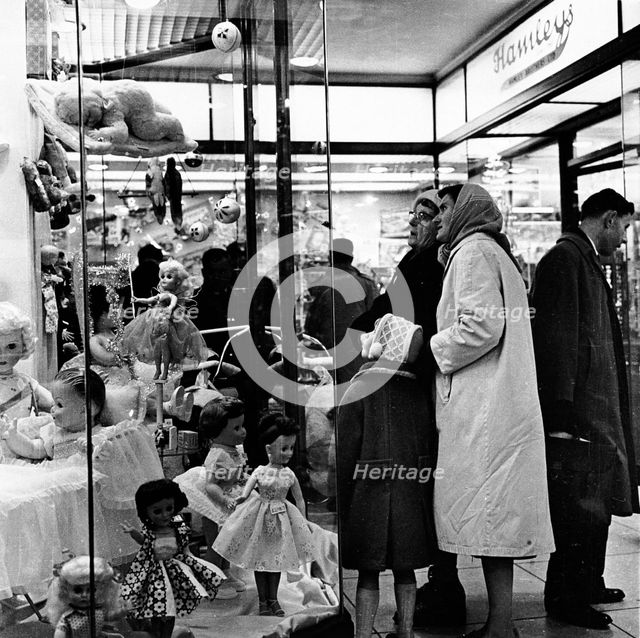Shoppers window shopping in London, c1960. Creator: Unknown.