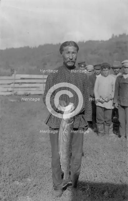 Shoria Man with Fish, Caught in the River Mrassu Rapid, 1913. Creator: GI Ivanov.