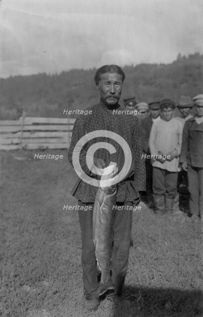 Shoria Man with Fish, Caught in the River Mrassu Rapid, 1913. Creator: GI Ivanov.