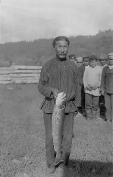 Shoria Man with Fish, Caught in the River Mrassu Rapid, 1913. Creator: GI Ivanov
