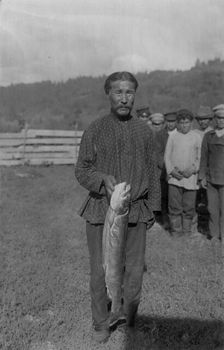 Shoria Man with Fish, Caught in the River Mrassu Rapid, 1913. Creator: GI Ivanov