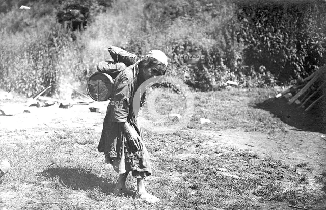 Shoria Woman Carrying a Load, 1913. Creator: GI Ivanov.