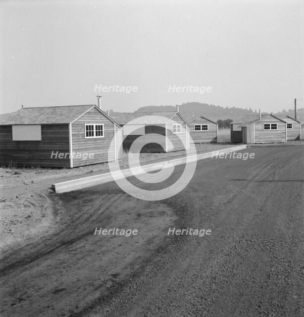 Shows new type of wooden shelter for migratory workers, near McMinnville, Oregon, 1939. Creator: Dorothea Lange.