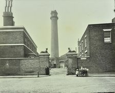 Shot Tower, gates with sphinxes, and milk cart, Belvedere Road, Lambeth, London, 1930