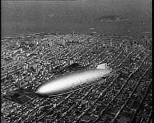 Shot of a Zeppelin Flying Over Manhattan, 1932. Creator: British Pathe Ltd