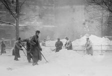 Shovelling snow in City Hall Park, New York, 1910. Creator: Bain News Service