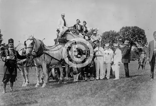 Shriners on water wagon, Rochester, between c1910 and c1915. Creator: Bain News Service.