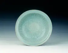Si Satchanalai celadon dish with carved peony and fluted decoration, Thailand, 14th-15th century. Creator: Unknown