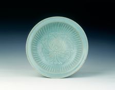 Si Satchanalai celadon dish with carved peony and fluted decoration, Thailand, 14th-15th century