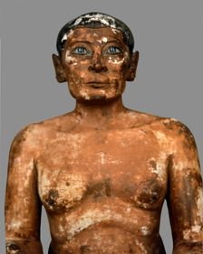 Sitting scribe in polychromed limestone, height 53 cm. belonging to the 5th Dynasty