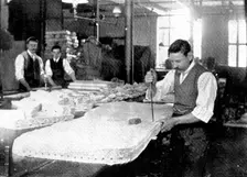 Sixty at a blow: cutting flannel shirts, 1909. Creator: Unknown