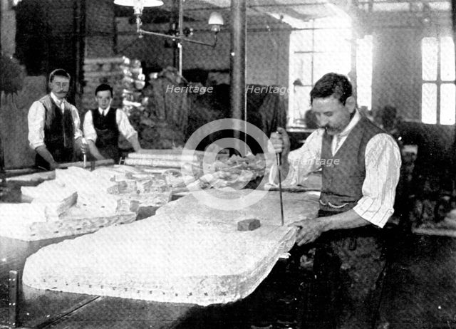 Sixty at a blow: cutting flannel shirts, 1909. Creator: Unknown.