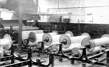 Sizing, which prepares and strengthens the yarns for the process of weaving, 1909. Creator: Unknown