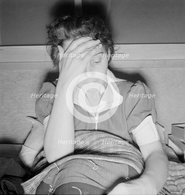 Sick woman awaits visit of the doctor, FSA camp, Merill, Klamath County, Oregon, 1939. Creator: Dorothea Lange.