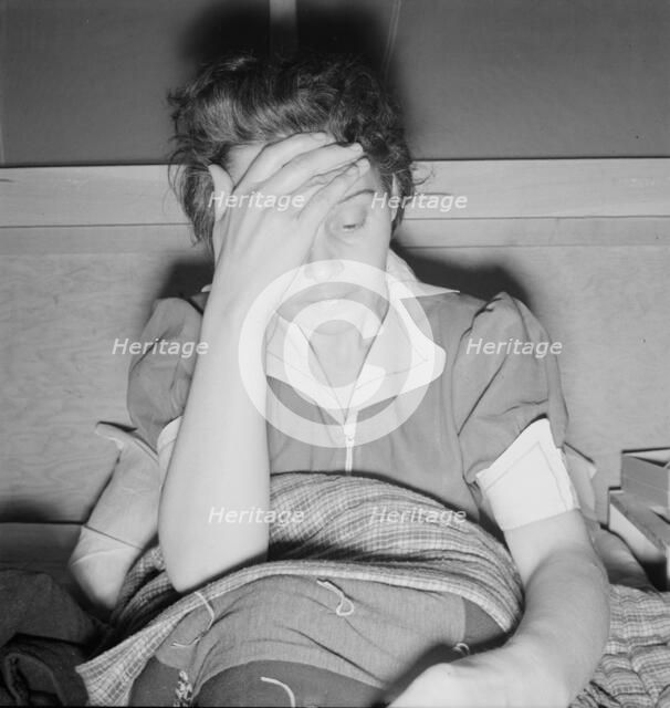 Sick woman awaits visit of the doctor, FSA camp, Merill, Klamath County, Oregon, 1939. Creator: Dorothea Lange.