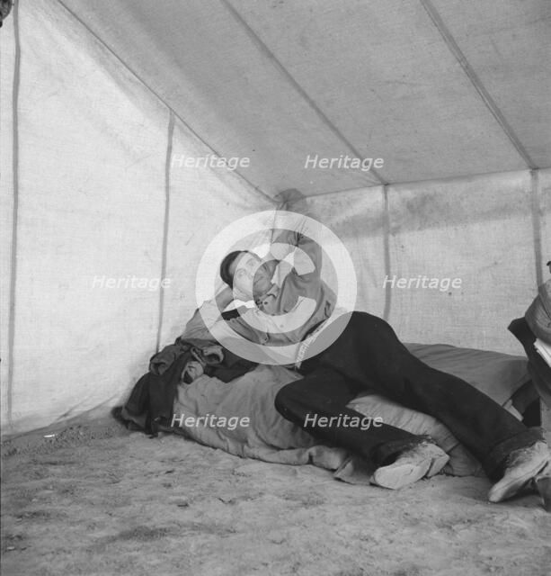 Sick migratory worker from Colorado in FSA camp, Calipatria, Imperial Valley, 1939. Creator: Dorothea Lange.