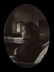 Side profile of a young woman with a misshapen head, wrapped in a tartan shawl, probably... Creator: Unknown