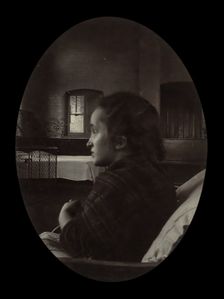 Side profile of a young woman with a misshapen head, wrapped in a tartan shawl, probably... Creator: Unknown