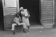 Sidewalk scene, Alabama, 1936. Creator: Walker Evans