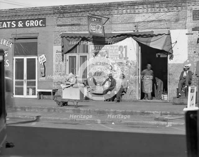 Sidewalk scene in Selma, Alabama, 1935. Creator: Walker Evans.