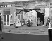 Sidewalk scene in Selma, Alabama, 1935. Creator: Walker Evans