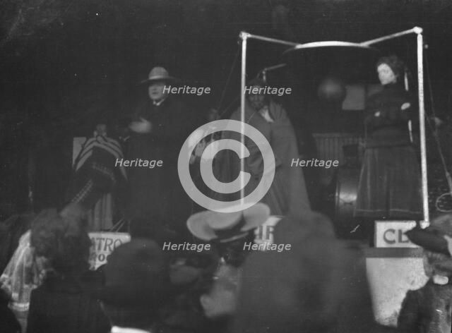 Sidewalk performance or carnival performance, Cliff Dwellers, between 1896 and 1911. Creator: Arnold Genthe.