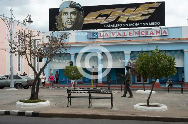 Sign 'advertising' the bravery of Che Guevara overlooking the pedestrian area, Cienfuegos, Cuba,2024 Creator: Ethel Davies.