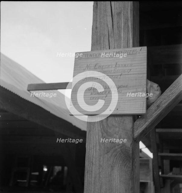 Sign at a tomato packing shed for migrant and local labor, Hazelhurst, Mississippi, 1937. Creator: Dorothea Lange.