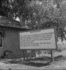 Sign at bridge between Juarez, Mexico and El Paso, Texas, 1937. Creator: Dorothea Lange