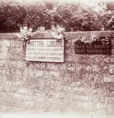 Sign in memory of civilians who were shot by the Germans, Dinant, Belgium, c1914-c1918