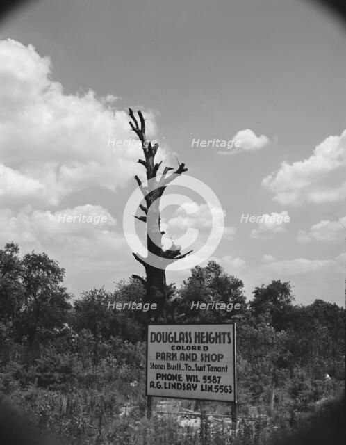 Sign on Alabama Avenue, Frederick Douglass housing project, Anacostia, D.C (vicinity), 1942. Creator: Gordon Parks.
