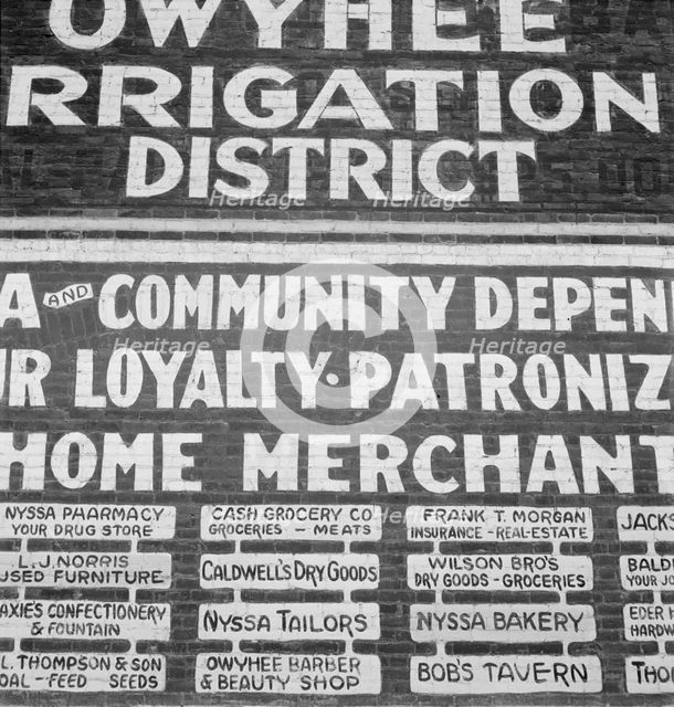 Sign on old bank building now used for office of Bureau..., Nyssa, Malheur County, Oregon, 1939. Creator: Dorothea Lange.