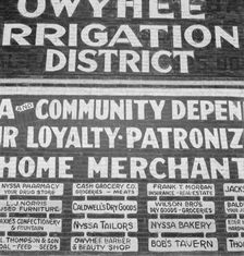 Sign on old bank building now used for office of Bureau..., Nyssa, Malheur County, Oregon, 1939. Creator: Dorothea Lange